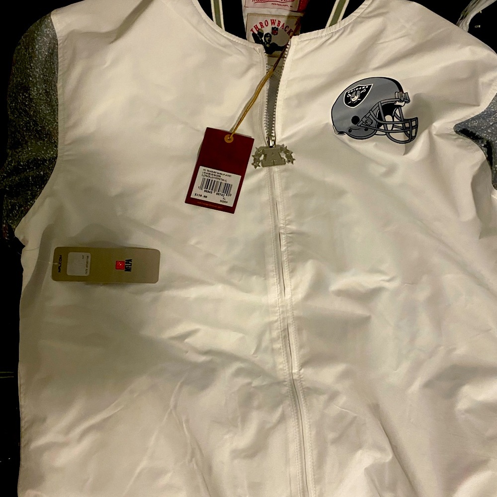 A white in black Mitchell & Ness jacket.